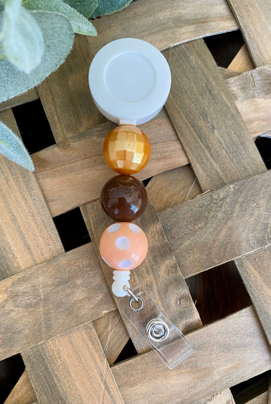 Peach/Brown/Gold Badge Reel